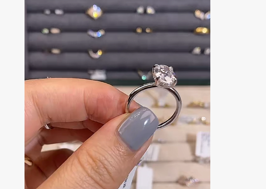 2‑carat oval ring for Ernie